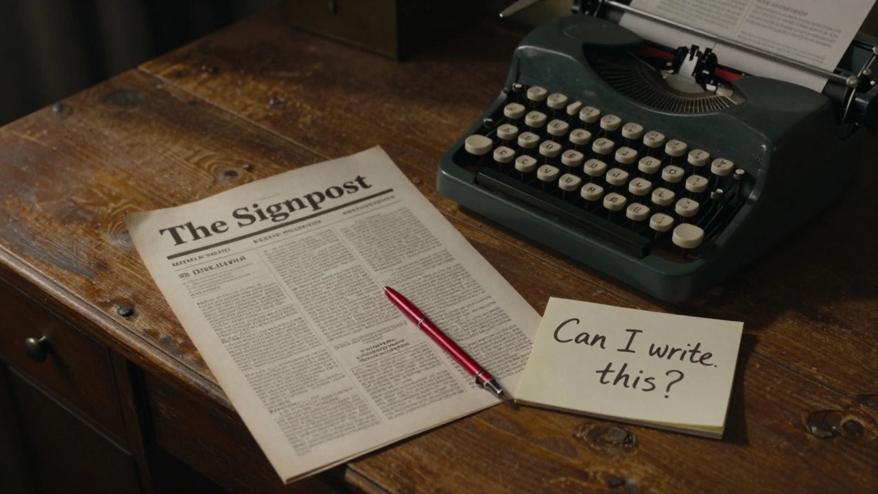 Stacked printed issues of The Signpost on a wooden desk with a handwritten note.